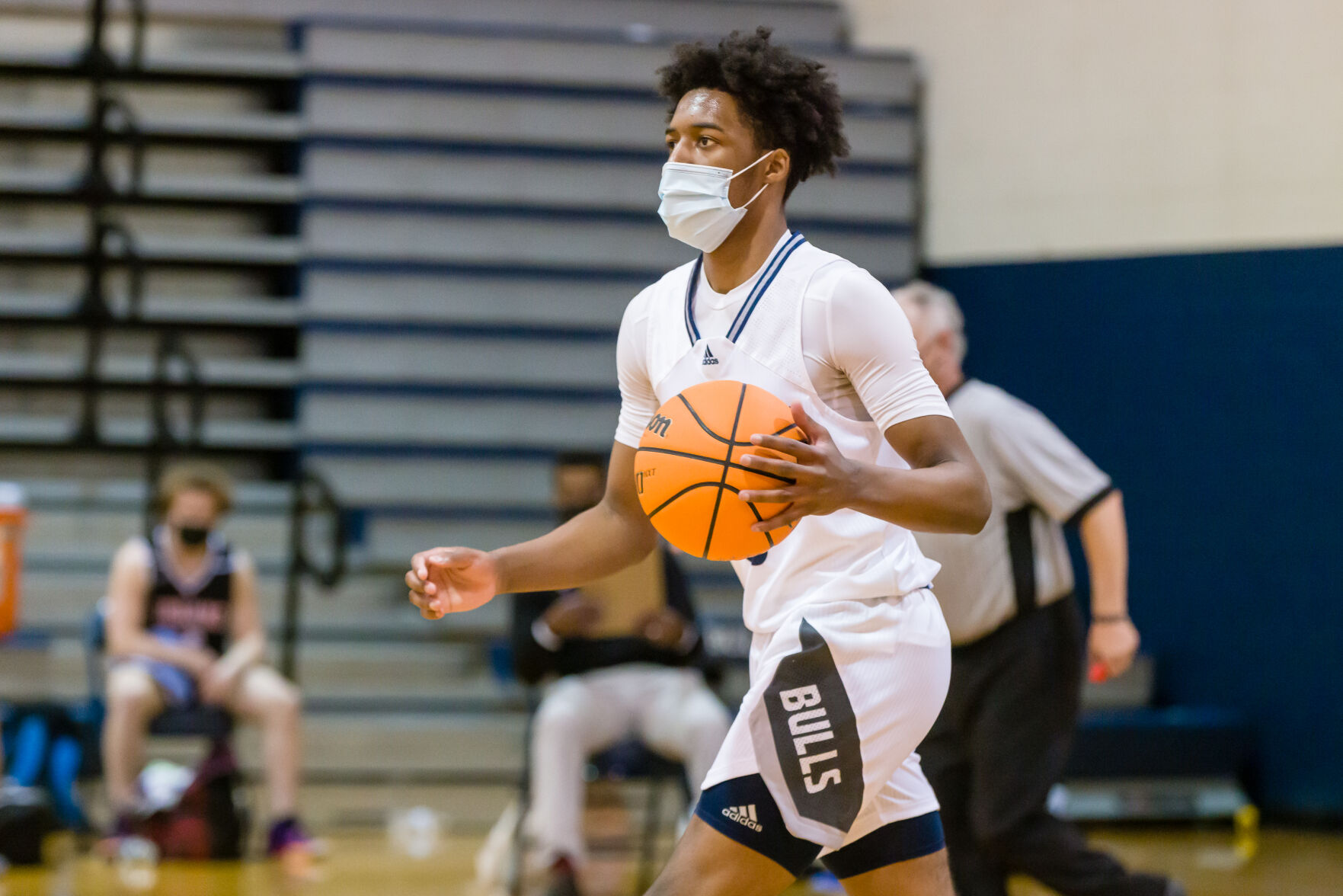 Boys Basketball: Hickory Ridge RaginÕ Bulls defeated the Northwest Cabarrus Trojans 64-56.